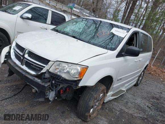 2012 Dodge Grand Caravan SE with VIN 2C4RDGBG9CR232038, listed as a IAAI auction lot 41823766 with 77,468 mi miles and . Bid and sale history available at DreamBid. Image 2.