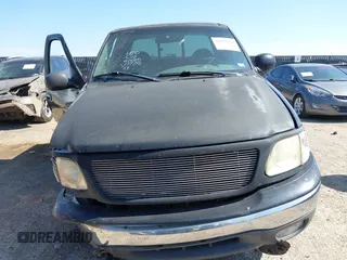 1999 Ford F-150 XL with VIN 1FTRX18L3XKA77743, listed as a IAAI auction lot 42512532 with Not provided miles and . Bid and sale history available at DreamBid. Image 13.