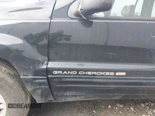 1999 Jeep Grand Cherokee Limited with VIN 1J4GW68S8XC588500, listed as a IAAI auction lot 41484787 with 161,961 mi miles. Bid and sale history available at carsss.com. Image 12.