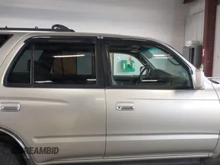 1999 Toyota 4Runner SR5 z VIN JT3HN86R8X0221532, wystawiony jako IAAI lot #41902556 z przebiegiem 406 602 mil mil oraz . Historia ofert i sprzedaży dostępna na DreamBid. Obrazek 14.