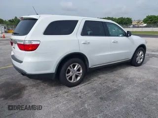 2013 Dodge Durango SXT with VIN 1C4RDHAG1DC669503, listed as a IAAI auction lot 42614210 with 103,482 mi miles and . Bid and sale history available at DreamBid. Image 4.