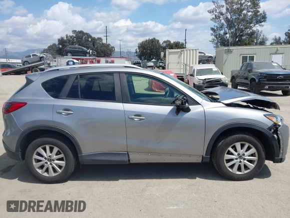 2014 Mazda CX-5 Touring z VIN JM3KE2CYXE0322943, wystawiony jako IAAI lot #41934670 z przebiegiem 110 690 mil mil oraz . Historia ofert i sprzedaży dostępna na DreamBid. Obrazek 13.