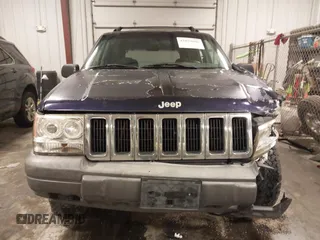 1997 Jeep Grand Cherokee Laredo with VIN 1J4GZ58S8VC675487, listed as a IAAI auction lot 41034046 with 243,284 mi miles. Bid and sale history available at carsss.com. Image 12.