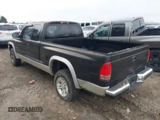 2001 Dodge Dakota SLT with VIN 1B7GG22XX1S255292, listed as a IAAI auction lot 41100133 with 168,454 mi miles and . Bid and sale history available at carsss.com. Image 3.