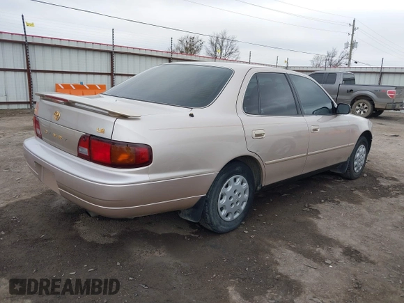 1996 Toyota Camry DX with VIN 4T1BG12K8TU738565, listed as a IAAI auction lot 41702096 with 100,587 mi miles. Bid and sale history available at carsss.com. Image 4.
