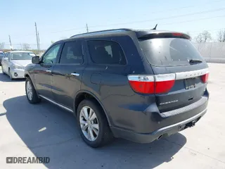 2013 Dodge Durango Crew with VIN 1C4SDHDT5DC637535, listed as a IAAI auction lot 41867982 with 162,569 mi miles. Bid and sale history available at carsss.com. Image 3.