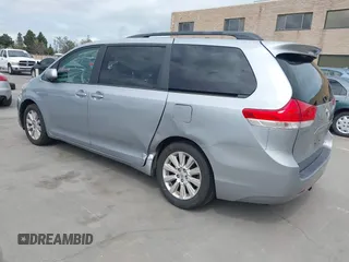 2014 Toyota Sienna LE with VIN 5TDJK3DC1ES080711, listed as a IAAI auction lot 41910679 with 118,788 mi miles and . Bid and sale history available at DreamBid. Image 3.