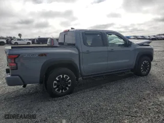 2024 Nissan Frontier PRO-4X with VIN 1N6ED1EK8RN659581, listed as a Copart auction lot 44911715 with 6,215 mi miles and Salvage Title. Bid and sale history available at carsss.com. Image 3.