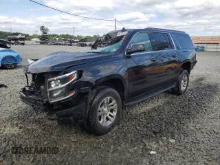 2019 Chevrolet Suburban LT with VIN 1GNSKHKC6KR202548, listed as a Copart auction lot 60195714 with 156,087 mi miles and Salvage Title. Bid and sale history available at DreamBid. Image 1.