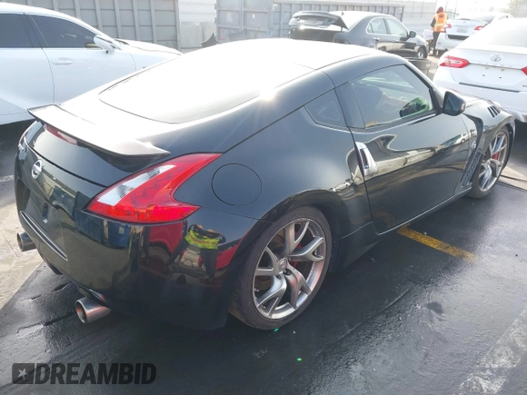 2014 Nissan 370Z Touring with VIN JN1AZ4EH1EM631097, listed as a IAAI auction lot 41230197 with 85,304 mi miles. Bid and sale history available at carsss.com. Image 4.