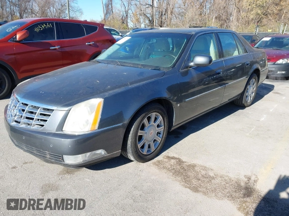 2009 Cadillac DTS 1SA z VIN 1G6KD57Y89U128646, wystawiony jako IAAI lot #40976417 z przebiegiem 167 346 mil mil oraz . Historia ofert i sprzedaży dostępna na DreamBid. Obrazek 2.