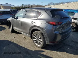2021 Mazda CX-5 Grand Touring with VIN JM3KFBDM9M0490239, listed as a Copart auction lot 43306975 with 47,010 mi miles and Salvage Title. Bid and sale history available at carsss.com. Image 2.