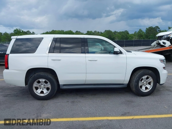 2015 Chevrolet Tahoe Commercial z VIN 1GNLC2EC1FR721538, wystawiony jako IAAI lot #42274601 z przebiegiem 138 991 mil mil oraz . Historia ofert i sprzedaży dostępna na DreamBid. Obrazek 13.