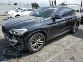 2020 BMW X4 xDrive30i z VIN 5UX2V1C0XL9B93562, wystawiony jako Copart lot #56180595 z przebiegiem 71 667 mil mil oraz Szkoda całkowita • Salvage title. Historia ofert i sprzedaży dostępna na DreamBid. Obrazek 1.