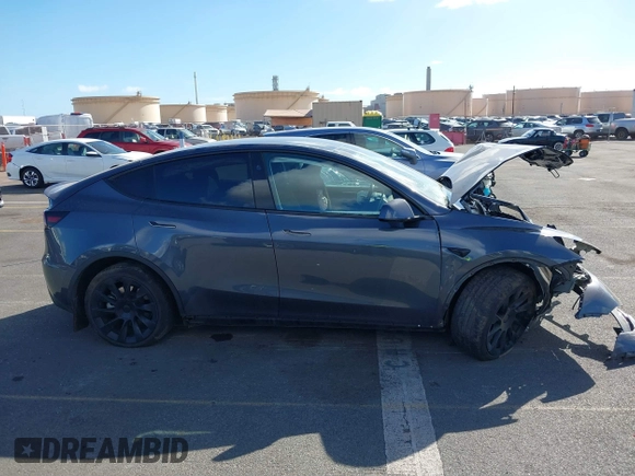 2023 Tesla Model Y Long Range z VIN 7SAYGAEE4PF945847, wystawiony jako IAAI lot #41071924 z przebiegiem 33 454 mil mil oraz . Historia ofert i sprzedaży dostępna na DreamBid. Obrazek 14.