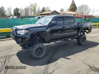 2019 Toyota Tacoma SR z VIN 3TMCZ5AN1KM253032, wystawiony jako Copart lot #52598445 z przebiegiem 69 489 mil mil oraz Szkody całkowita. Historia ofert i sprzedaży dostępna na DreamBid. Obrazek 1.