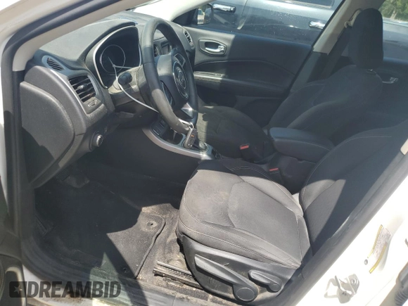 2018 Jeep Compass Sport with VIN 3C4NJCAB1JT193185, listed as a Copart auction lot 64463715 with 148,872 mi miles and Salvage title. Bid and sale history available at DreamBid. Image 7.