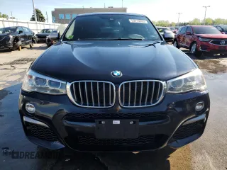 2018 BMW X4 M40i with VIN 5UXXW7C54J0Z44932, listed as a Copart auction lot 55973605 with 101,479 mi miles and Salvage title. Bid and sale history available at DreamBid. Image 5.