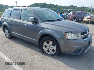 2012 Dodge Journey SXT with VIN 3C4PDDBG9CT213833, listed as a IAAI auction lot 42848746 with 187,205 mi miles and . Bid and sale history available at DreamBid. Image 1.