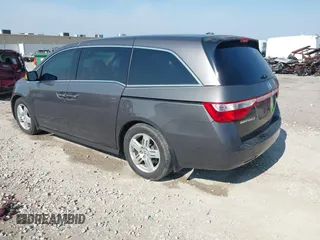2013 Honda Odyssey Touring with VIN 5FNRL5H98DB080296, listed as a IAAI auction lot 42461843 with 104,901 mi miles and . Bid and sale history available at DreamBid. Image 3.