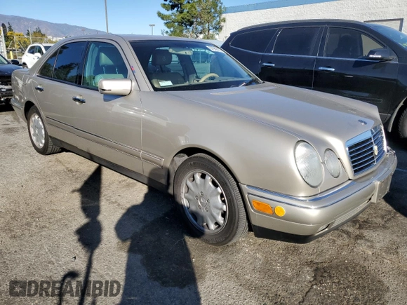 1998 Mercedes-Benz E-Class with VIN WDBJF65FXWA497997, listed as a Copart auction lot 87969125 with 145,322 mi miles and Salvage Title. Bid and sale history available at carsss.com. Image 4.