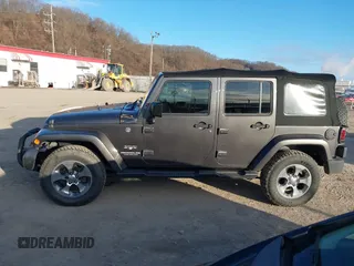 2017 Jeep Wrangler Unlimited Sahara with VIN 1C4BJWEG9HL507908, listed as a IAAI auction lot 41880209 with 99,773 mi miles. Bid and sale history available at carsss.com. Image 14.