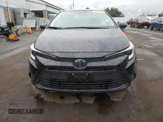 2023 Toyota Corolla Hybrid LE with VIN JTDBDMHE2P3002183, listed as a Copart auction lot 50292785 with 7,065 mi miles and Salvage Title. Bid and sale history available at carsss.com. Image 5.