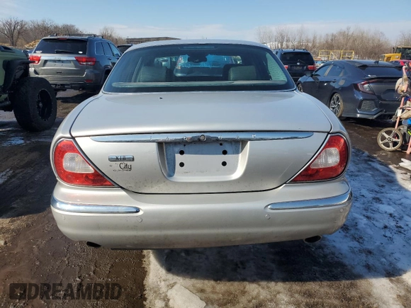 2004 Jaguar XJ with VIN SAJEA71C04SG04022, listed as a Copart auction lot 45875105 with 153,453 mi miles and Salvage Title. Bid and sale history available at carsss.com. Image 6.