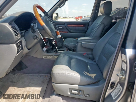 2001 Lexus LX 470 z VIN JTJHT00W313504330, wystawiony jako Copart lot #61126435 z przebiegiem 87 049 mil mil oraz Czysty tytuł • Clean title. Historia ofert i sprzedaży dostępna na DreamBid. Obrazek 7.