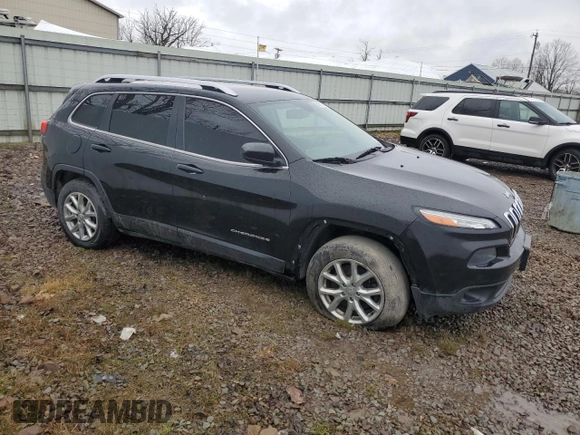 2015 Jeep Cherokee Latitude with VIN 1C4PJMCBXFW504433, listed as a Copart auction lot 52767515 with 141,969 mi miles and Clean Title. Bid and sale history available at carsss.com. Image 4.