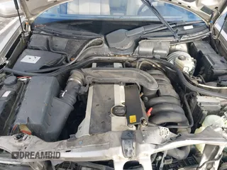 1997 Mercedes-Benz E-Class with VIN WDBJF55F3VA391335, listed as a IAAI auction lot 41606546 with 1 mi miles. Bid and sale history available at carsss.com. Image 10.