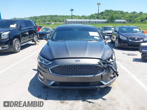 2020 Ford Fusion Titanium with VIN 3FA6P0K96LR173971, listed as a IAAI auction lot 42232469 with 82,474 mi miles and . Bid and sale history available at DreamBid. Image 13.