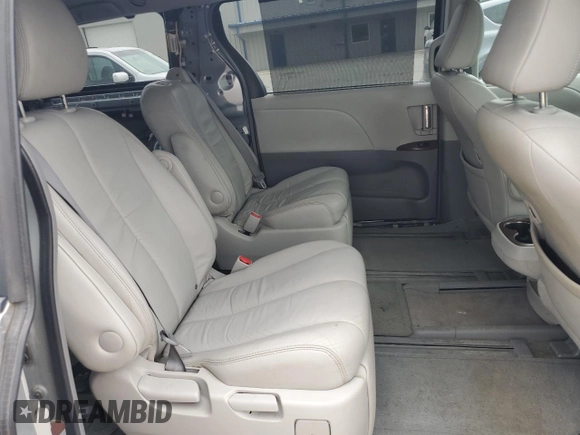 2011 Toyota Sienna XLE z VIN 5TDDK3DC1BS018203, wystawiony jako Copart lot #58807795 z przebiegiem 103 177 mil mil oraz Szkoda całkowita • Salvage title. Historia ofert i sprzedaży dostępna na DreamBid. Obrazek 11.