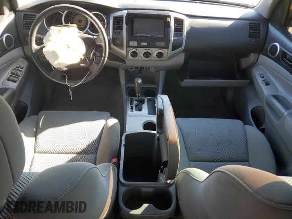 2010 Toyota Tacoma PreRunner with VIN 3TMKU4HN3AM025218, listed as a Copart auction lot 87600035 with 92,605 mi miles and Salvage title. Bid and sale history available at DreamBid. Image 8.