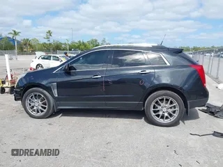 2013 Cadillac SRX Performance Collection z VIN 3GYFNDE39DS543037, wystawiony jako IAAI lot #42162276 z przebiegiem 156 282 mil mil oraz . Historia ofert i sprzedaży dostępna na DreamBid. Obrazek 14.