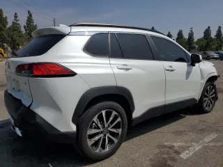 2023 Toyota Corolla Cross XLE with VIN 7MUDAAAG2PV042957, listed as a Copart auction lot 60301555 with 39,211 mi miles and Salvage title. Bid and sale history available at DreamBid. Image 3.