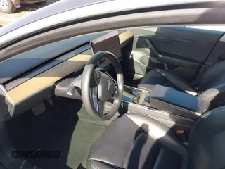 2020 Tesla Model 3 Long Range with VIN 5YJ3E1EB6LF666624, listed as a IAAI auction lot 41720664 with 65,973 mi miles. Bid and sale history available at carsss.com. Image 5.