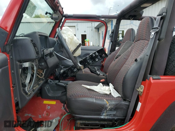 2000 Jeep Wrangler SE with VIN 1J4FA29P6YP793045, listed as a Copart auction lot 58756715 with 202,110 mi miles and Salvage title. Bid and sale history available at DreamBid. Image 7.