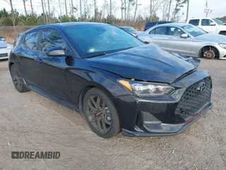 2019 Hyundai Veloster Turbo z VIN KMHTH6AB9KU005942, wystawiony jako IAAI lot #41565229 z przebiegiem 91 788 mil mil oraz . Historia ofert i sprzedaży dostępna na DreamBid. Obrazek 1.