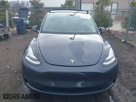 2023 Tesla Model Y Long Range with VIN 7SAYGDEE8PF599254, listed as a IAAI auction lot 41718342 with 24,339 mi miles and . Bid and sale history available at carsss.com. Image 13.