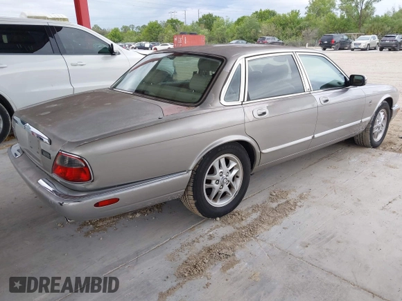 1999 Jaguar XJ with VIN SAJHX1043XC856474, listed as a IAAI auction lot 41626649 with 103,266 mi miles and . Bid and sale history available at DreamBid. Image 4.