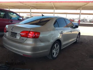 2014 Volkswagen Jetta TDI w/Premium with VIN 3VWLL7AJ1EM228062, listed as a IAAI auction lot 42256650 with 218,955 mi miles and . Bid and sale history available at DreamBid. Image 4.