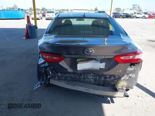 2019 Toyota Camry LE with VIN 4T1B11HK8KU204599, listed as a IAAI auction lot 42096889 with 76,518 mi miles and . Bid and sale history available at DreamBid. Image 17.