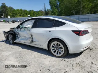 2023 Tesla Model 3 with VIN 5YJ3E1EA9PF558088, listed as a Copart auction lot 52228465 with 63,204 mi miles and Salvage title. Bid and sale history available at DreamBid. Image 2.