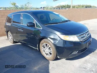 2012 Honda Odyssey EX-L with VIN 5FNRL5H60CB023322, listed as a IAAI auction lot 41334750 with 174,916 mi miles and . Bid and sale history available at DreamBid. Image 1.