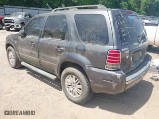 2005 Mercury Mariner Luxury with VIN 4M2CU57195DJ25103, listed as a IAAI auction lot 42032296 with 154,134 mi miles. Bid and sale history available at carsss.com. Image 3.