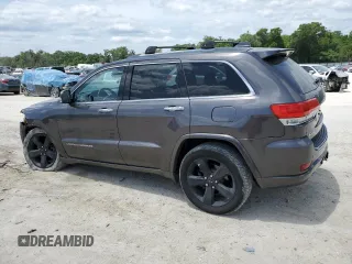 2014 Jeep Grand Cherokee Overland with VIN 1C4RJFCT7EC182234, listed as a Copart auction lot 54754465 with 185,658 mi miles and Salvage Title. Bid and sale history available at DreamBid. Image 2.
