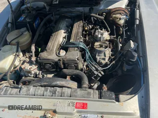 1984 Mercedes-Benz SL with VIN WDB1070421A009542, listed as a Copart auction lot 65327125 with 142,656 mi miles and Clean title. Bid and sale history available at DreamBid. Image 7.