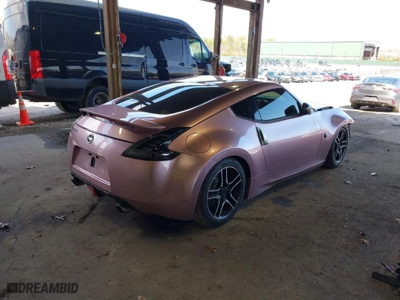 2014 Nissan 370Z with VIN JN1AZ4EH7EM631492, listed as a IAAI auction lot 41871006 with 68,354 mi miles. Bid and sale history available at carsss.com. Image 4.