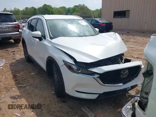 2018 Mazda CX-5 Touring z VIN JM3KFACM5J0402455, wystawiony jako IAAI lot #42006127 z przebiegiem 105 809 mil mil oraz . Historia ofert i sprzedaży dostępna na DreamBid. Obrazek 1.